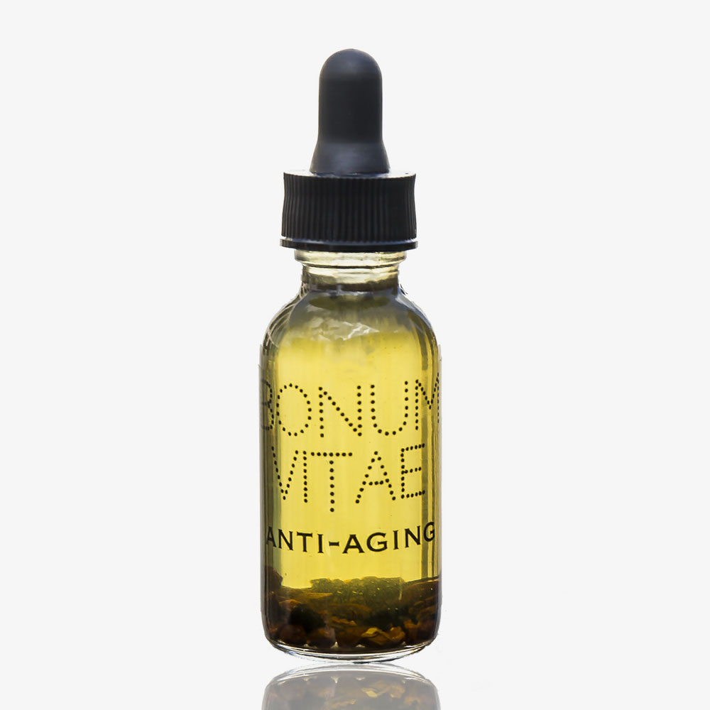 A bottle of anti-aging serum sitting on top of a table.